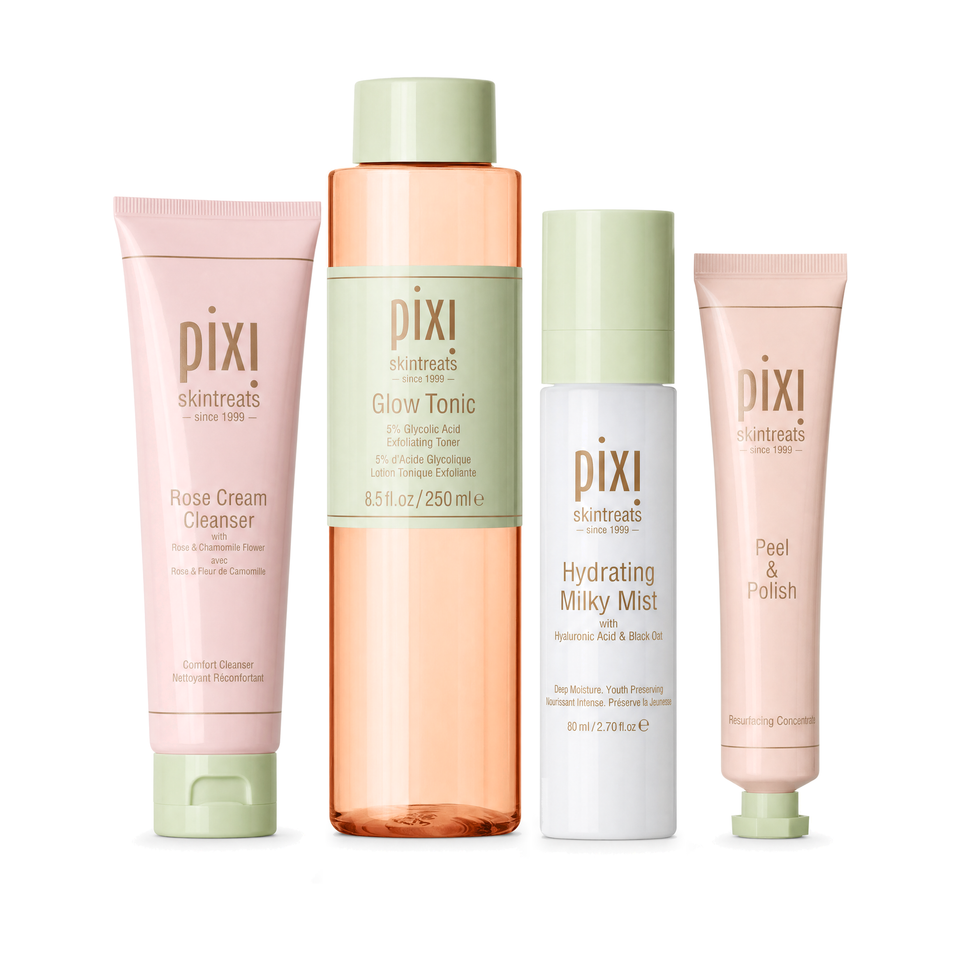Four Pixi Skintreats skincare bottles and tubes arranged on a white background: Rose Cream Cleanser in a pink tube, Glow Tonic in a peach translucent bottle with a mint cap, Hydrating Milky Mist in a white bottle with a mint cap, and Peel & Polish in a pale pink tube with a mint cap. view 1