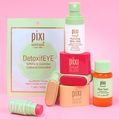 Pixi Skintreats skincare set on a pink background, featuring DetoxifEYE eye patches, a Hydrating Milky Mist, On-the-Glow Blush and SuperGlow Petites and others. view 2
