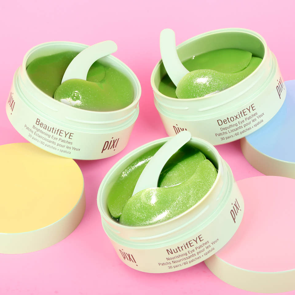 Three jars of Pixi eye patches on a pink background - BeautifEYE, DetoxifEYE and NutrifEYE shown. view 2