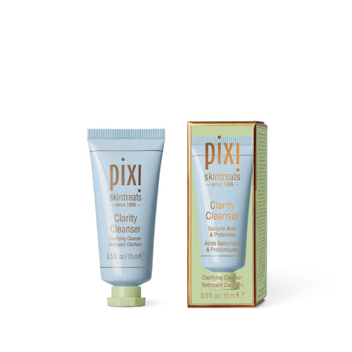 Pixi Skintreats Clarity Cleanser shown as a light blue squeeze tube with a pale green cap next to its matching light green and gold outer box on a white background. view 2