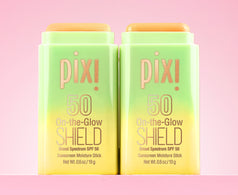 2 bottles of On-the-Glow SHIELD shown on a pink background - View 1