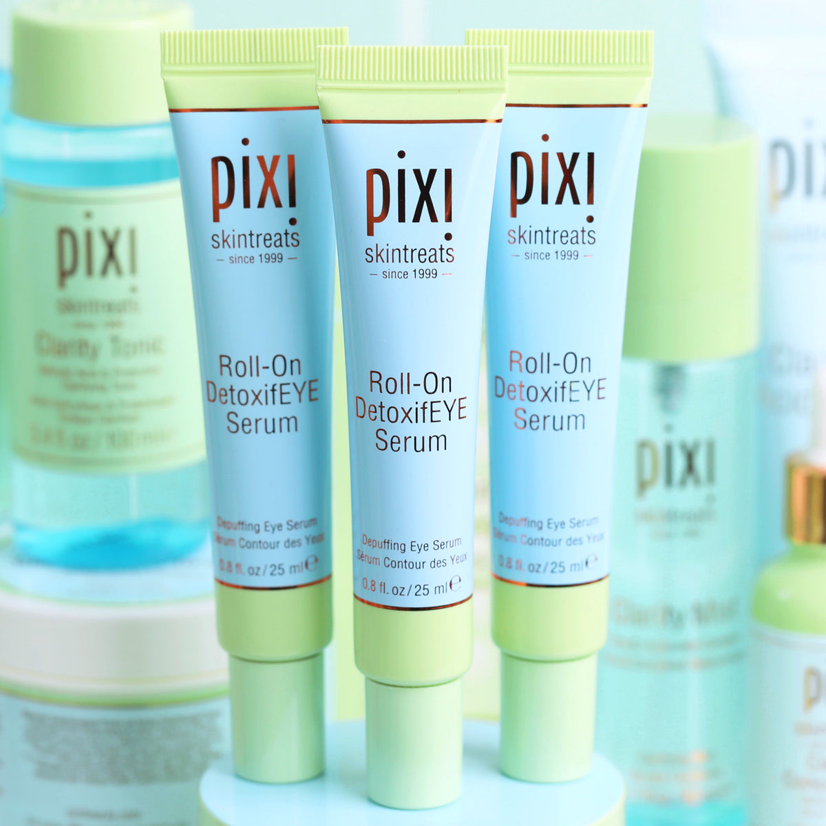 Pixi Roll-On DetoxifEYE serum products including a bottle and two tubes of DetoxifEYE Serum on a light background.