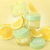 Vitamin-C CremeSerum with lemon slices on a yellow background